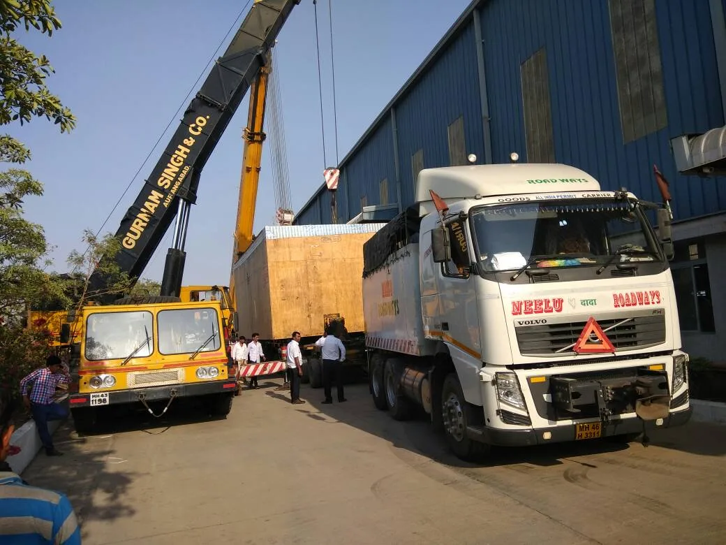 Multi-axle commercial transport carrying heavy plant machinery across Kerala industrial corridors.