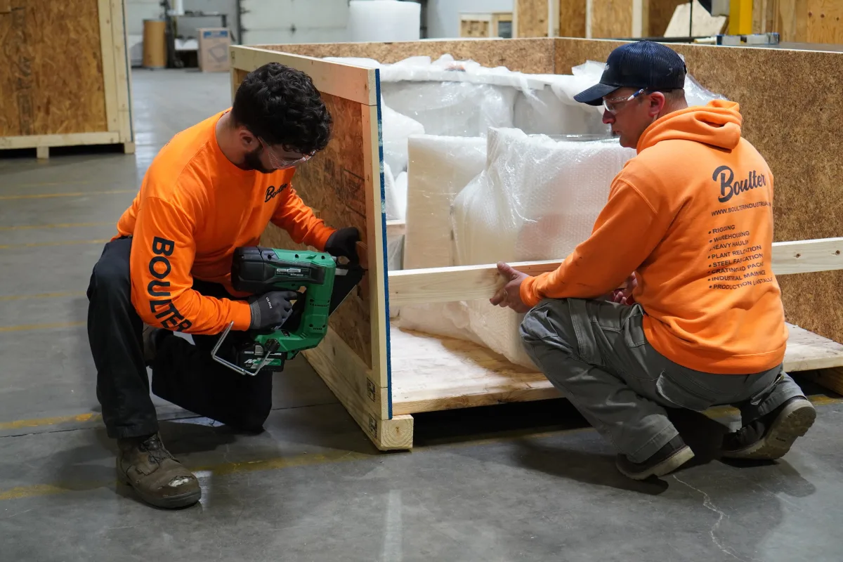 TrucGOs crew assembling an ISPM 15 compliant wooden crate for export in Kochuveli Industrial Area